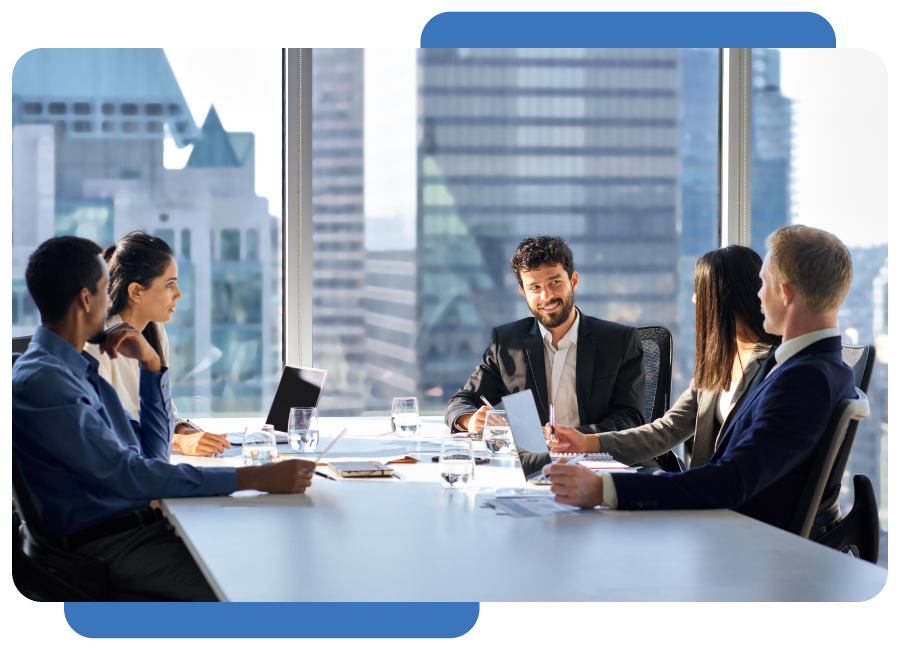 Happy international multiethnic professional business team, diverse executive colleagues people discussing financial project working together in office at group meeting table in corporate board room.